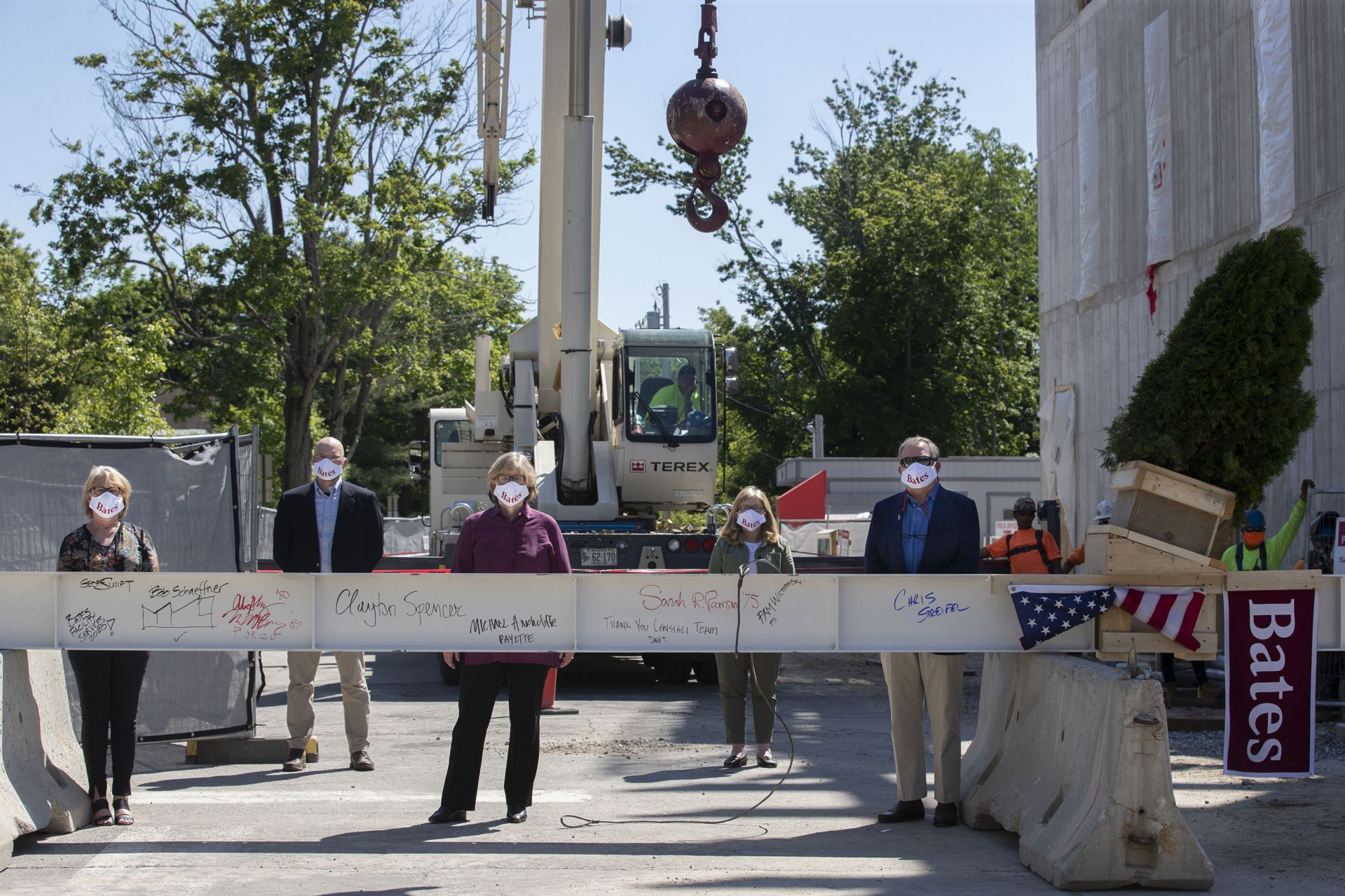 Images from the topping off event on May 16, 2020, at the Bonney Science Center, featuring the final major piece of structural steel being installed on the building. In keeping with tradition, a small spruce tree was attached to the beam fluttered plus a Bates banner and the American flag. The beam has the signatures of Bates participants and members of the Consigli construction crew.

Participants: 		Michael W. Bonney ’80, P’09, P’12, P’15
Alison Grott Bonney ’80, P’09, P’12, P’15
Sarah R. Pearson ’75, Vice President for College Advancement
A. Clayton Spencer, President
Chris Streifel, Facilities Services Project Manager
Geoff Swift, Vice President for Finance and Administration and Treasurer
Pam Wichroski, Director of Capital Planning and Construction
Dave Thomas, Consigli Construction 
Michael Hinchcliffe, Payette Architecture Firm 
Bob Schaeffner, Payette Architecture Firm