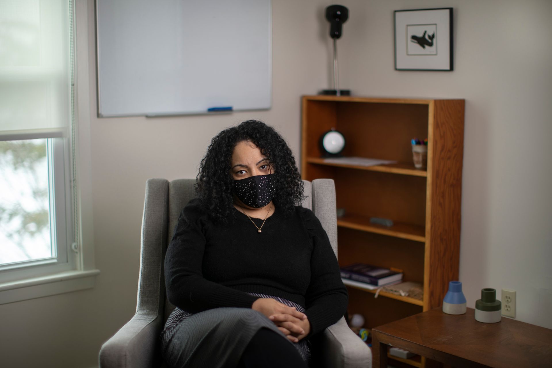 A psychological counselor sits in her office.