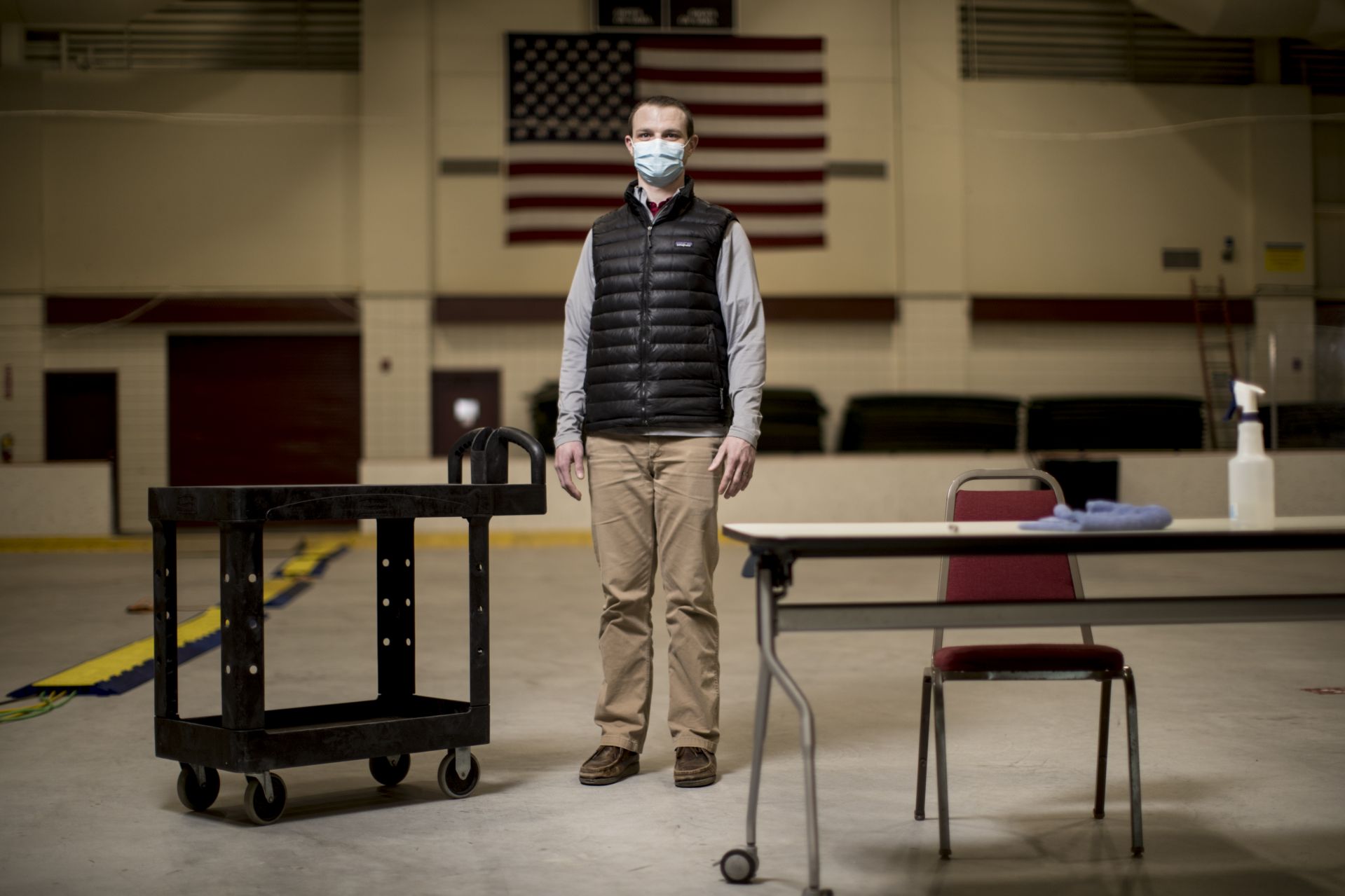 Benjamin Walker poses in the Underhill Testing Center for staff portrait project.

 Benjamin Walker, Certified Athletic Trainer

Your job title(s) and a brief description of your responsibilities in those roles
Pre-Covid, I worked as a Certified Athletic Trainer with Sports Medicine in the Athletics Department. I started working in the Testing Center this summer as the Director of Student-Facing Contact Tracing. In this role, I oversee the student-facing contact tracing team, notify students of positive test results, and assist with the isolation and quarantine procedure.