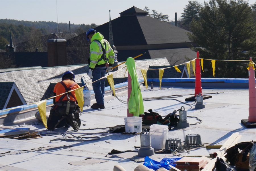 Roofers for Hahnel Bros. prepare to work on the Bonney Center’s north roof, out of view at left. In the background are Chase Hall, at left, and the Gray Athletic Building at rear. (Doug Hubley/Bates College)