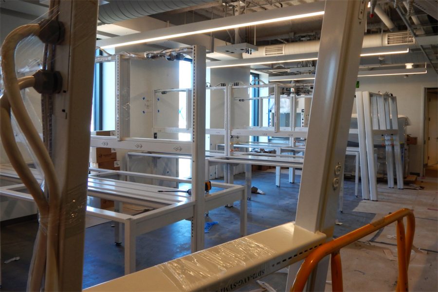 Lab benches being assembled in a third-story room. (Doug Hubley/Bates College)