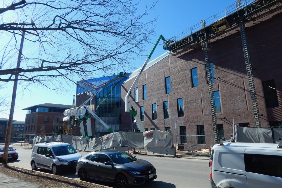 Shown on March 22, lifts bring workers and materials to spots on the Bonney Center's north side where masonry and roofing work is still in progress. (Doug Hubley/Bates College)