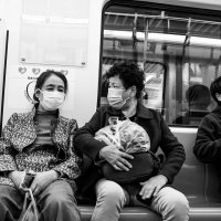 Metro riders wear masks in Qingdao, China, in November 2020. (Photograph by Gauthier Delecroix)