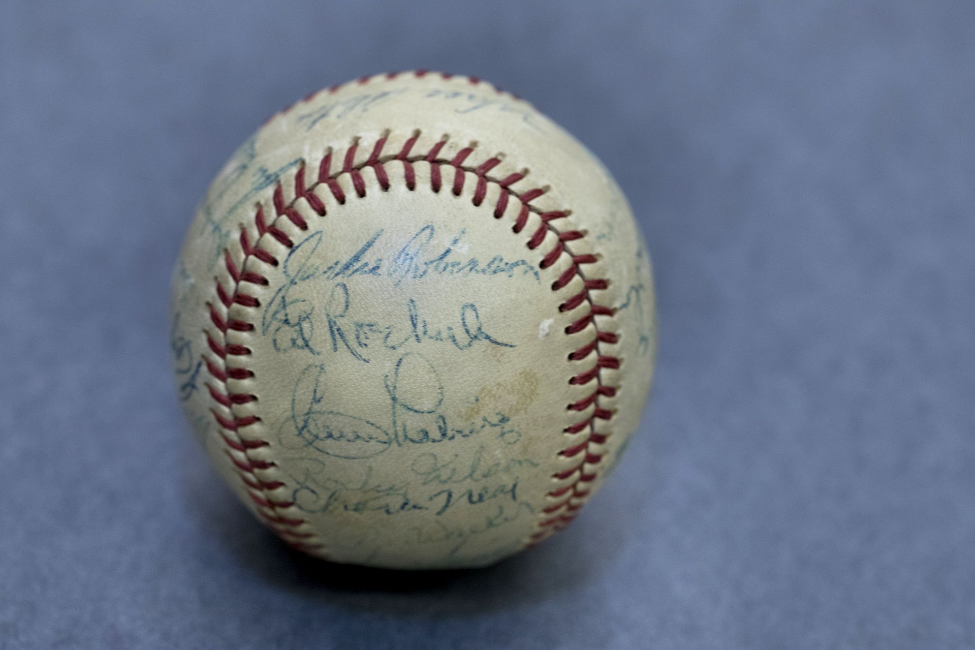 Objects in the College Archives, Ladd Library, with James "Pat" Webber, Information & Library Services, Director of Archives and Special Collections, Muskie Archives. Includes a baseball with Jackie Robinson's signature given to Ed Muskie, and a14th-century manuscript with  a doodle in the column.