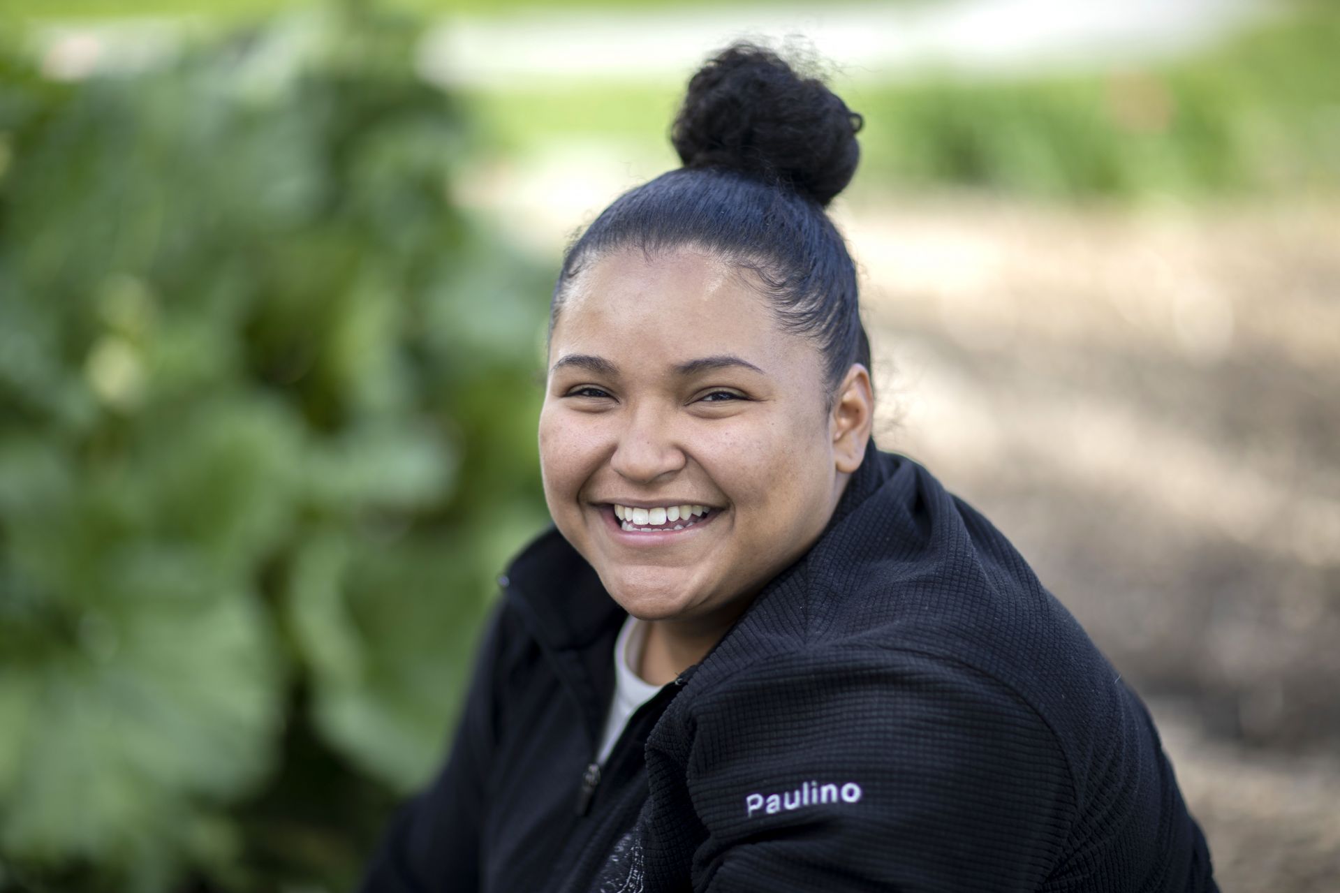 Genesis Paulino '21 of Lawrence, Mass., partners with St. Mary's Nutrition Center in a project titled "Developing Garden activity Bins for Local Teachers." Photographed in the Wood Street Garden adjacent to the Harward Center for Community Partnerships.

Also in the pictures are :
Eliza Huber-Weiss, st marys nutrition center
youth programs coordinator, in white t-shirt and bronze pants; Olivia Sandford ‘20 in Bates athletics sweatshirt; Kristen Farney, St. Mary's Nutrition Center Fellow with carpenter's hat; and St. Mary's Nutrition Center Fellow Victor Bing with hat and spade. Not showing up in selects is St. Mary's nutrition center volunteer Randy Hard.

STA/RT, that is — the Short Term Action/Research Team, a working group comprising 10 students who head downtown every year for five-week projects with local partners.

With support from the Harward Center for Community Partnerships, the students bring skills, stick-to-itiveness, and, it turns out, a good dose of self-awareness to their work.