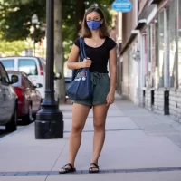 "Despite working remotely this summer, I’ve been glad to still be able to engage with the community a bit in-person like this.” —Anthropology major and Bonner Leader Hannah McKenzie of Stevenson, Md., photographed on Lewiston’s Lisbon Street and in the Heritage Restaurant and its adjacent market place, where she regularly shops and purchases tea. This summer, McKenzie has divided her time between two local organizations providing support to refugees and immigrants: the Immigrant Resource Center of Maine and Immigrant Legal Advocacy Project. The tea she purchases at the Heritage Restaurant, says Mckenzie “reminds me of one of the first cultural lessons I learned in Lewiston.” When Hamza Abdi, a community leader and an academic administrative assistant at Bates and she first started teaching an IRCM English class together her first semester at Bates, “Hamza would leave in the middle of each class to retrieve us each traditional Somali tea, flavored with spices like cinnamon and cardamom and sweetened in condensed milk. I loved this tea,” she says. “Only three months into teaching did I realize Hamza had been buying the tea from this restaurant downstairs, rather than making it in the office break room as I had assumed. I contested that I didn’t want him spending his money on me — after all, if I come to the Center twice weekly for four years, that’s a lot of money. Hamza laughed, well versed in the differences between our cultures. He explained that in Djiboutian culture, money is considered best used for gestures of sharing and showing others appreciation. Someone in his culture doesn’t ‘lose’ money, as people essentially take turns paying for their friends.” These days, Mckenzie regularly picks up tea at the Heritage Restaurant. “I really appreciate the culture of collectivity that surrounds it. These kind of cultural lessons are what have made my experience of Lewiston and my studies of anthropology at Bates so eye-opening a