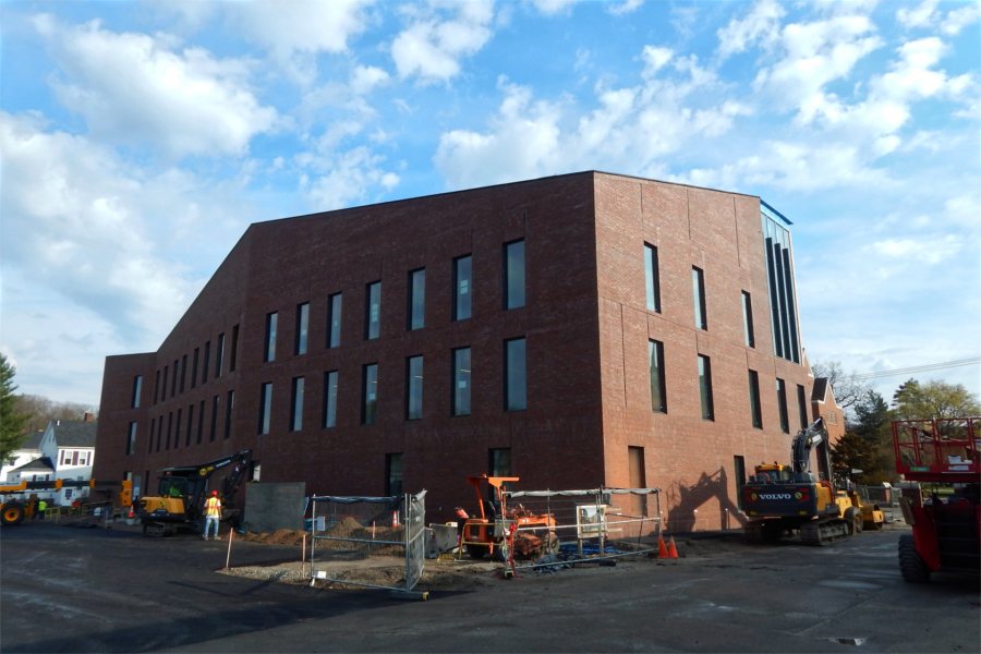 The south and east sides of the Bonney Science Center on April 21. Note the base coat of new paving behind the building. (Doug Hubley/Bates College)