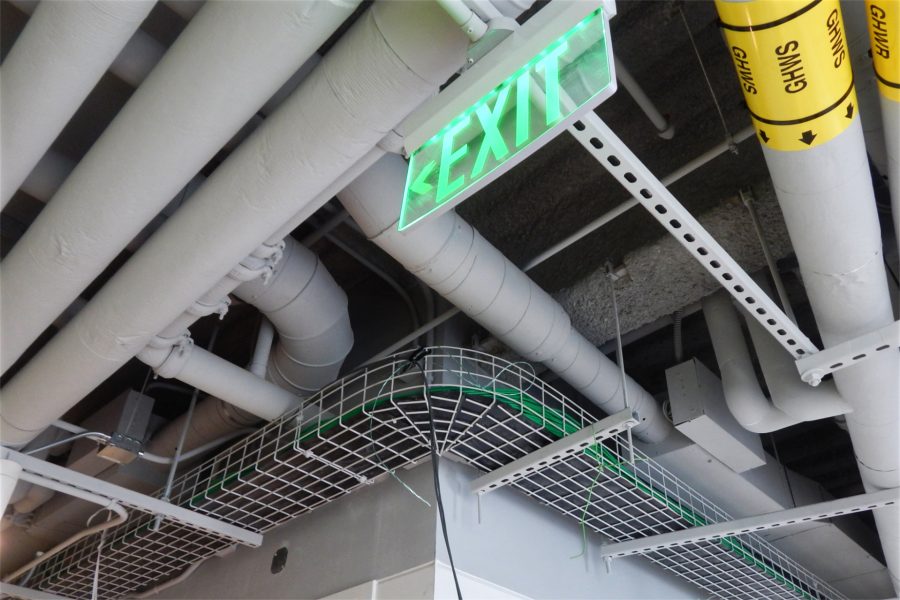 Called a cable tray, this mesh trough running along the second-floor ceiling carries more than 260 cables serving controls, communications, and IT. (Doug Hubley/Bates College)