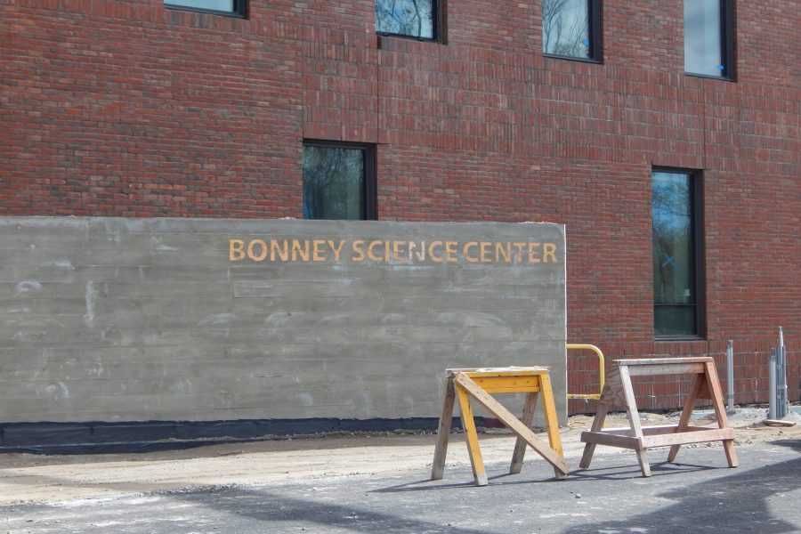 Proclaiming the name: Placed earlier this month, a concrete wall near the Bardwell Street entrance to the construction site is the first instance of the Bonney Center's name appearing on the building itself. (Doug Hubley/Bates College)