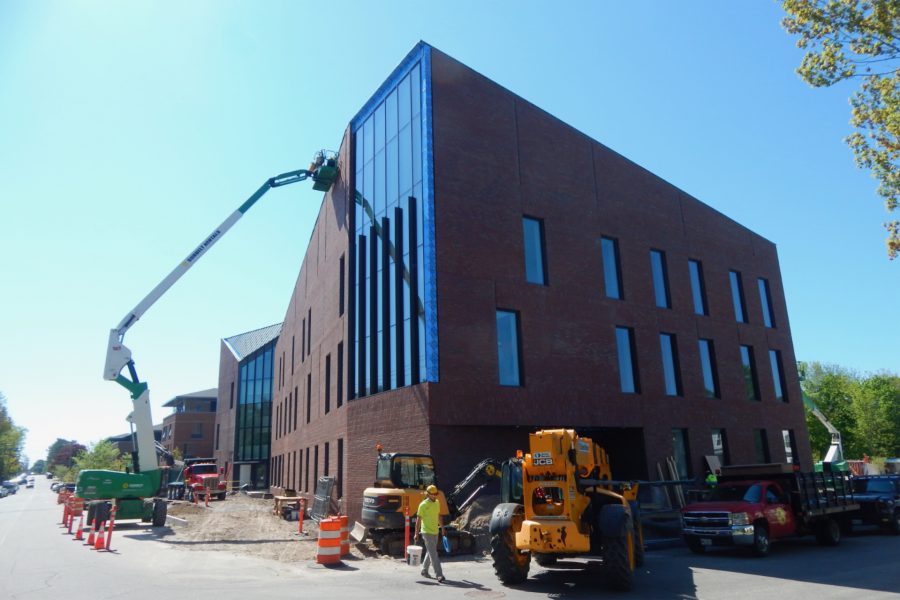 What's missing from this Bonney Science Center photo taken at the corner of Campus Avenue, at left, and Nichols Street? The site fence has been removed, making way for subcontractor Gendron & Gendron to  do site work around the front of the building. (Doug Hubley/Bates College)