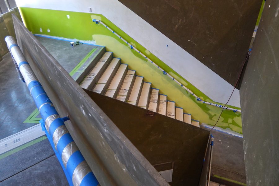 Painting in progress and polished (but dusty) concrete in the Monumental Stair. (Doug Hubley/Bates College)