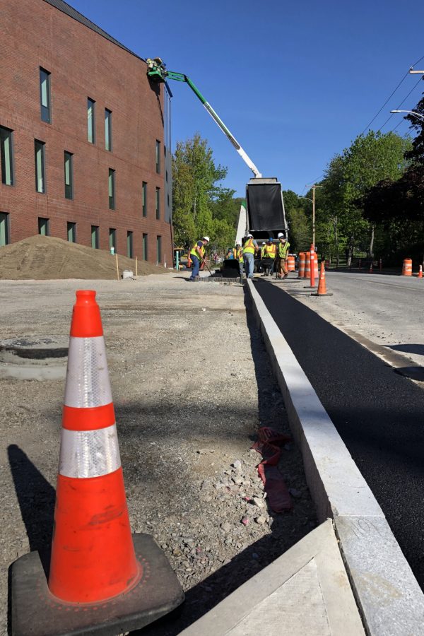 Site subcontractor Gendron & Gendron sets curbing along the Bonney Science Center's Campus Avenue frontage. (Jay Burns/Bates College)