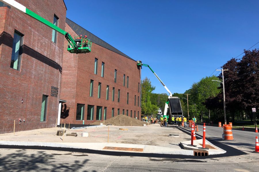 Exterior sitework at Bonney Science Center along Campus Avenue, including contractor Gendron & Gendron setting curbs at the entrance plaza that will be paved with asphalt blocks. (Jay Burns/Bates College)