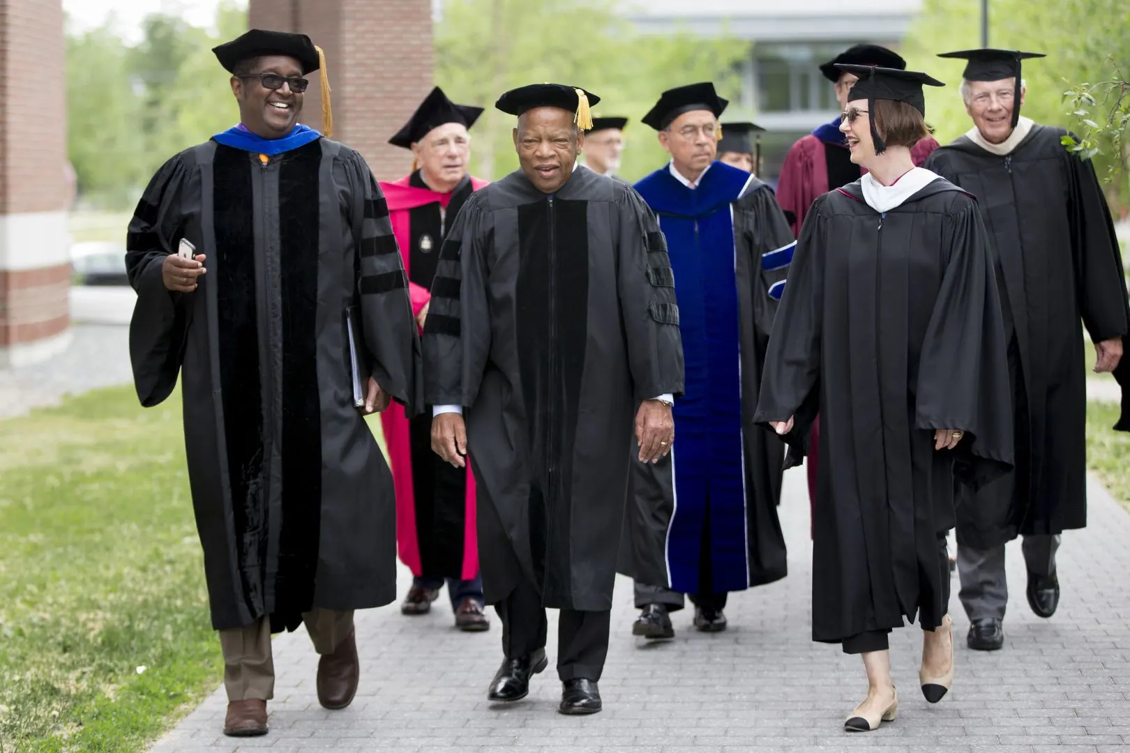 Commencement speaker John R. Lewis, the civil rights icon and congressman from Georgia, processes down Alumni Walk with Professor of Rhetoric Charles Nero and Bates Trustee Geraldine FitzGerald ’75. (Phyllis Graber Jensen/Bates College)