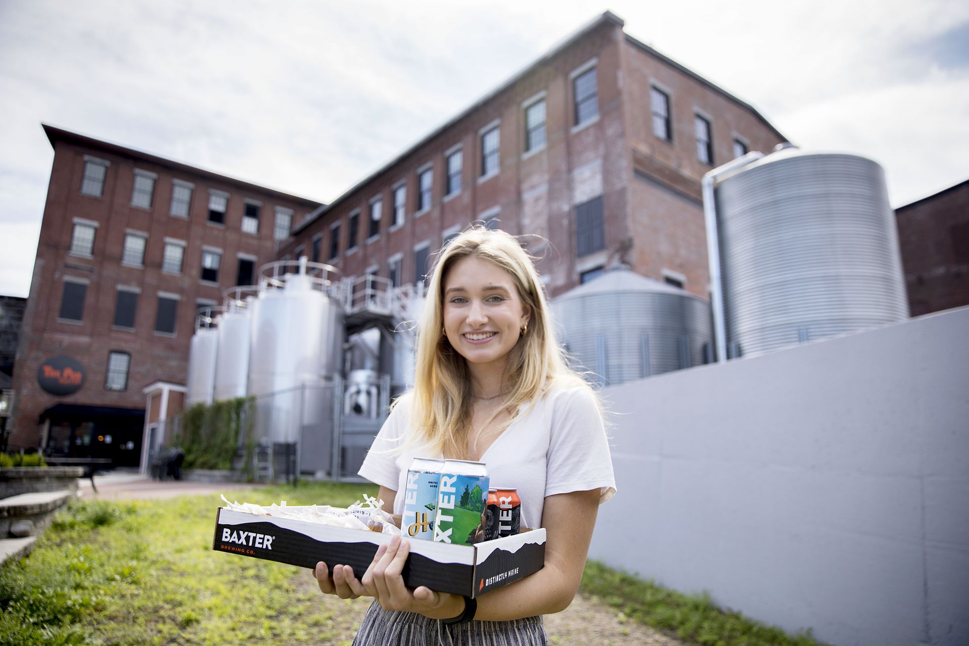 Emily Tamkin '22, a biology major from Lafayette, Calif., is doing a summer '21 purposeful work internship tin brewing science, partnering with the Baxter Brewing Co. in Lewiston, where she's studying the number of battering compounds that exist in beer throughout the brewing process. She is working under the supervision of Merritt Waldron, Baxter's quality control manager, and Assistant Professor of Biology Lori Banks.  Emily picks up samples from Baxter's plant at 130 Mill Street in Lewiston and takes them to Carnegie Science where, in Dr. Bank's lab, she conducts a chemical analysis of them. The compounds hit your taste buds, and your brain understands that they are bitter, she says.