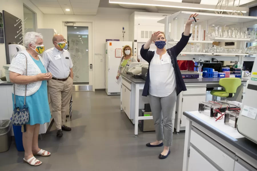 After the ribbon-cutting ceremony on Aug. 23, 2021, Associate Professor of Biology Larissa Williams gives a tour of her new laboratory space in the Bonney Science Center. (Phyllis Graber Jensen/Bates College)