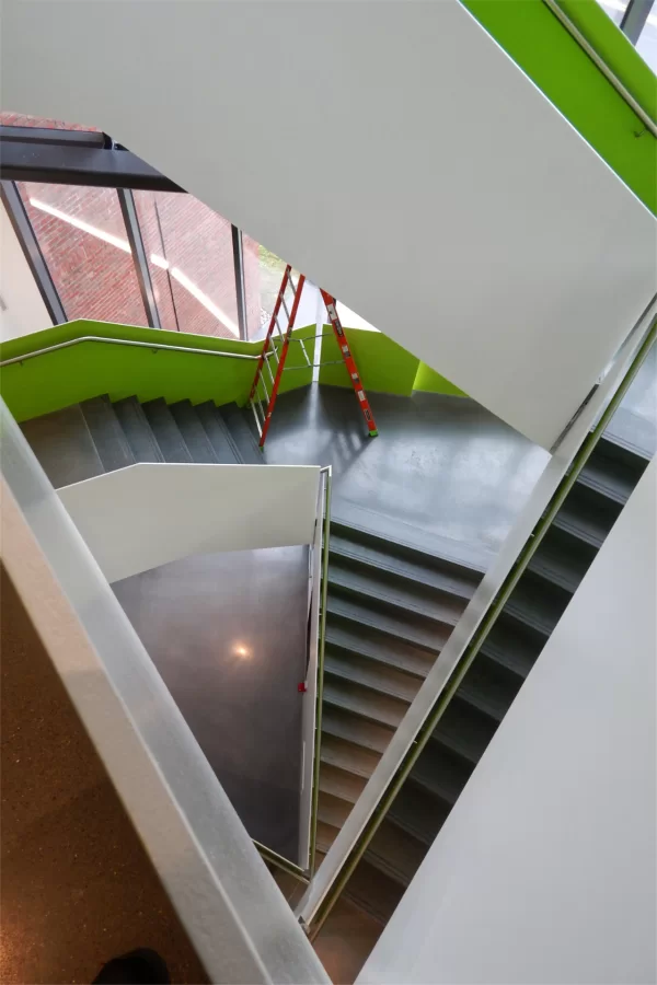Suddenly we're hungry for pie:  A look down through the Bonney Center's Monumental Stair reveals a variety of wedge-shaped views. The bright green is a visual hallmark of building designer Payette. (Doug Hubley/Bates College)