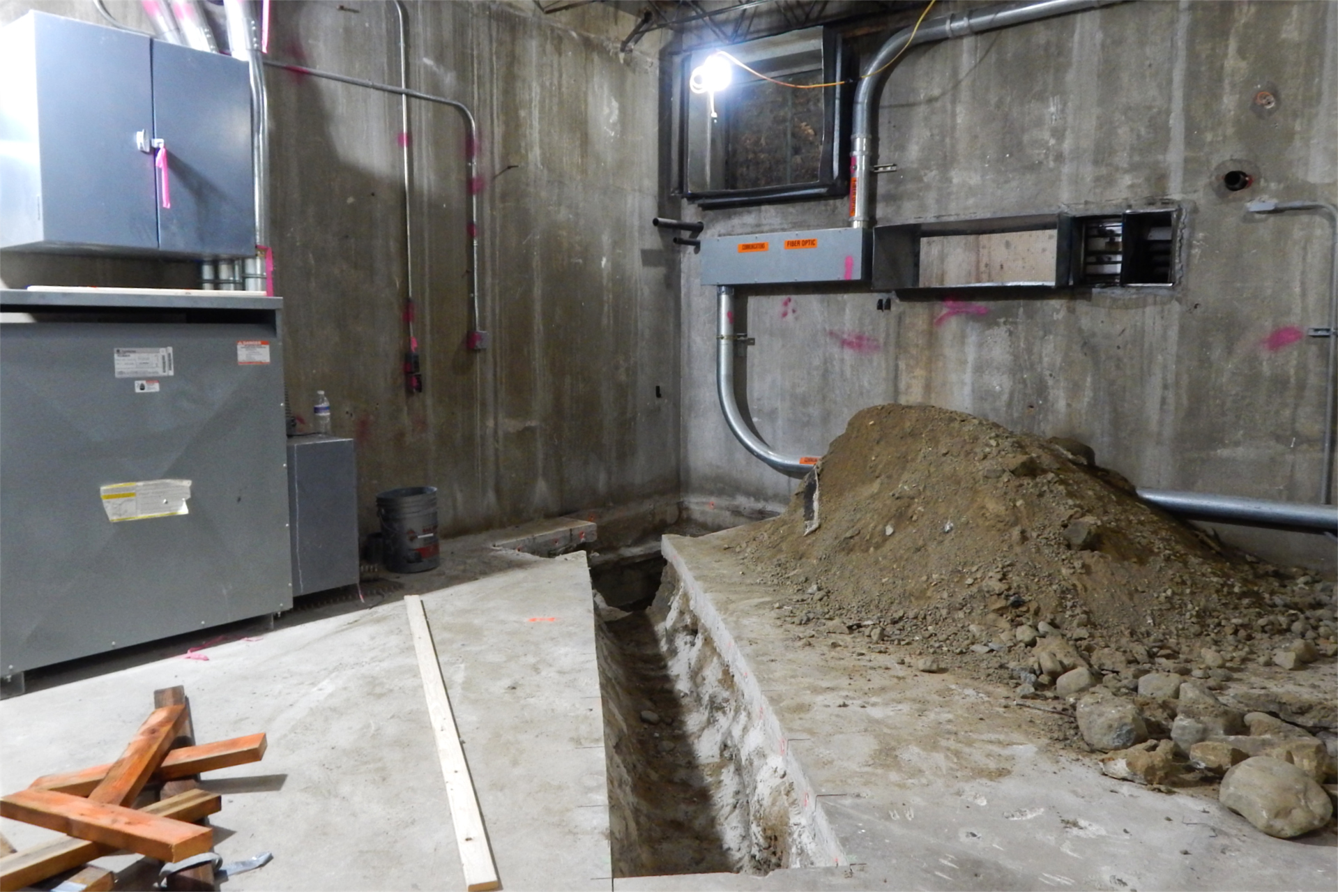 A new trench for floor drain infrastructure in the basement of Dana Chemistry. (Doug Hubley/Bates College)