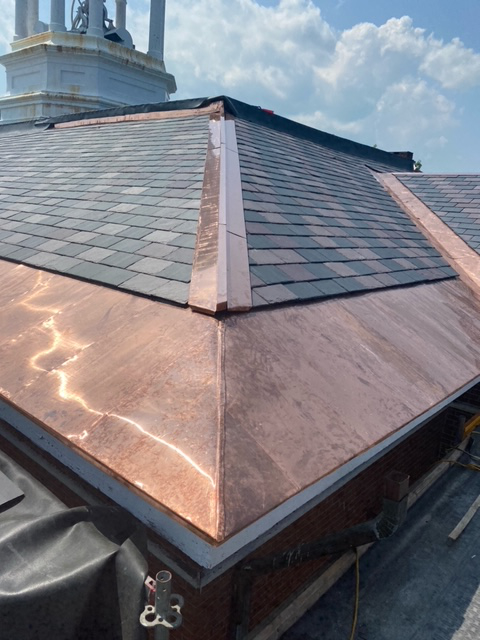 New slate roofing and copper flashing atop Hathorn Hall. (Robert Leavitt/Bates College)