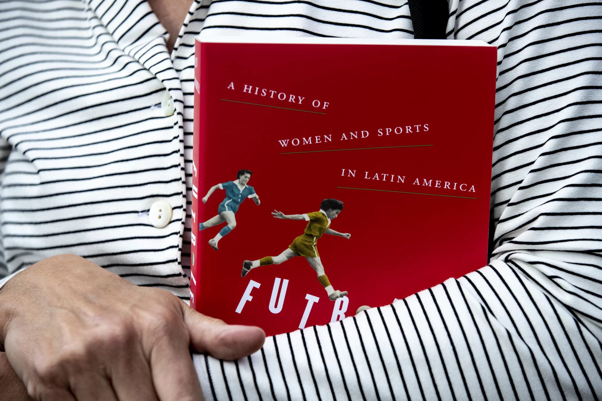 Scenes from campus on Sept. 21, 2021

Lecturer in Psychology Sue Langdon holding a book she received from colleague Karen Melvin of history department. She is using it to teach her first year seminar.