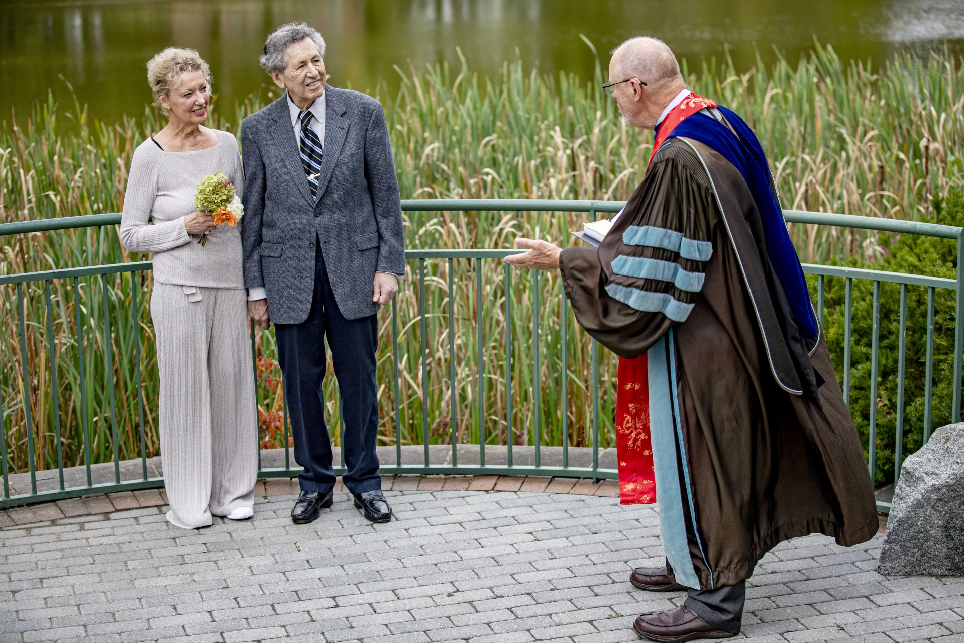 Bill Tucker ’66 and his wife of 31 years, Monica Drozd renew their vows at the Keigwin Amphitheatre on Friday, Sept. 24, in a ceremony officiated by Tucker’s classmate Bill Hiss ’66 and witnessed by Leadership Gift Officers Cary Gemmer Blake ’07 and Rebecca Lazure, both of Advancement. Also present was Colleen Quint ’86 and BCO writer Jen Wright.Hiss writes: “Bill and I had adjoining rooms in what is now Turner House in 1965-6, and have been clise friends ever since. Bill’s Bates story is a fascinating and very unconventional one…He first arrived in the late 1950’s, and with 4 years in between of active duty as an Army MP, finished in 1967. He then set a speed record for a Princeton Ph.D. In psychometrics, and moved into Camden, NJ, where he spent his entire career as a Psychology prof at Rutgers Camden. He wrote some masterful scholarly books both on the use of testing (an interest we have shared for decades), and on the hidden work of truly nasty right-wing foundations. To say that Bill has a lifelong commitment to racial and social justice is a big understatement.”“His Bates and family story is powerfully American: his paternal grandfather deserted from the Czar’s army as a Jewish conscript and walked from the Caucasus to Rotterdam to get a boat to America. His mother’s family, Viennese Jewish intellectuals, got out of Austria barely ahead of the Gestapo. Bill’s use of his Bates education has been masterful, and his philanthropic support goes to issues of racial justice, including some quiet support of bringing minority students from Camden to see Bates.”