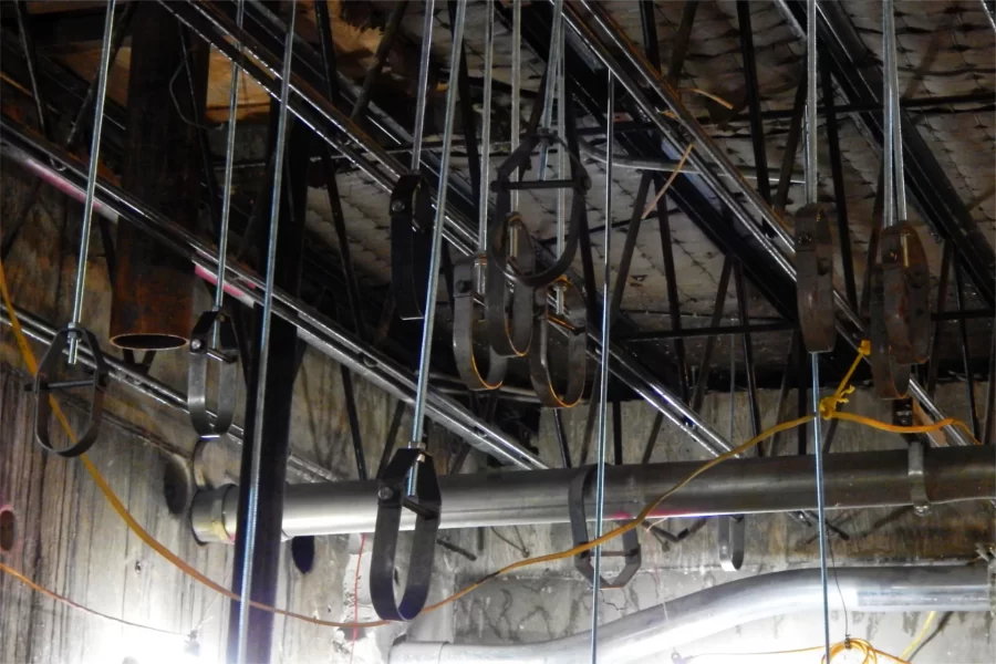 These hangers in the Dana Hall basement will support new overhead pipes, ducts, conduits, etc. (Doug Hubley/Bates College)