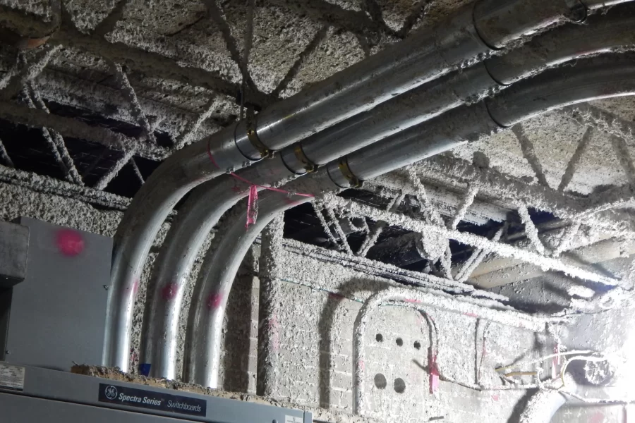 The coarsely textured material is fireproofing newly sprayed onto floor structure in Dana Chemistry Hall. The existing electrical equipment has plenty of life left in it and won't be replaced during the current (pardon the pun) renovation. (Doug Hubley/Bates College)