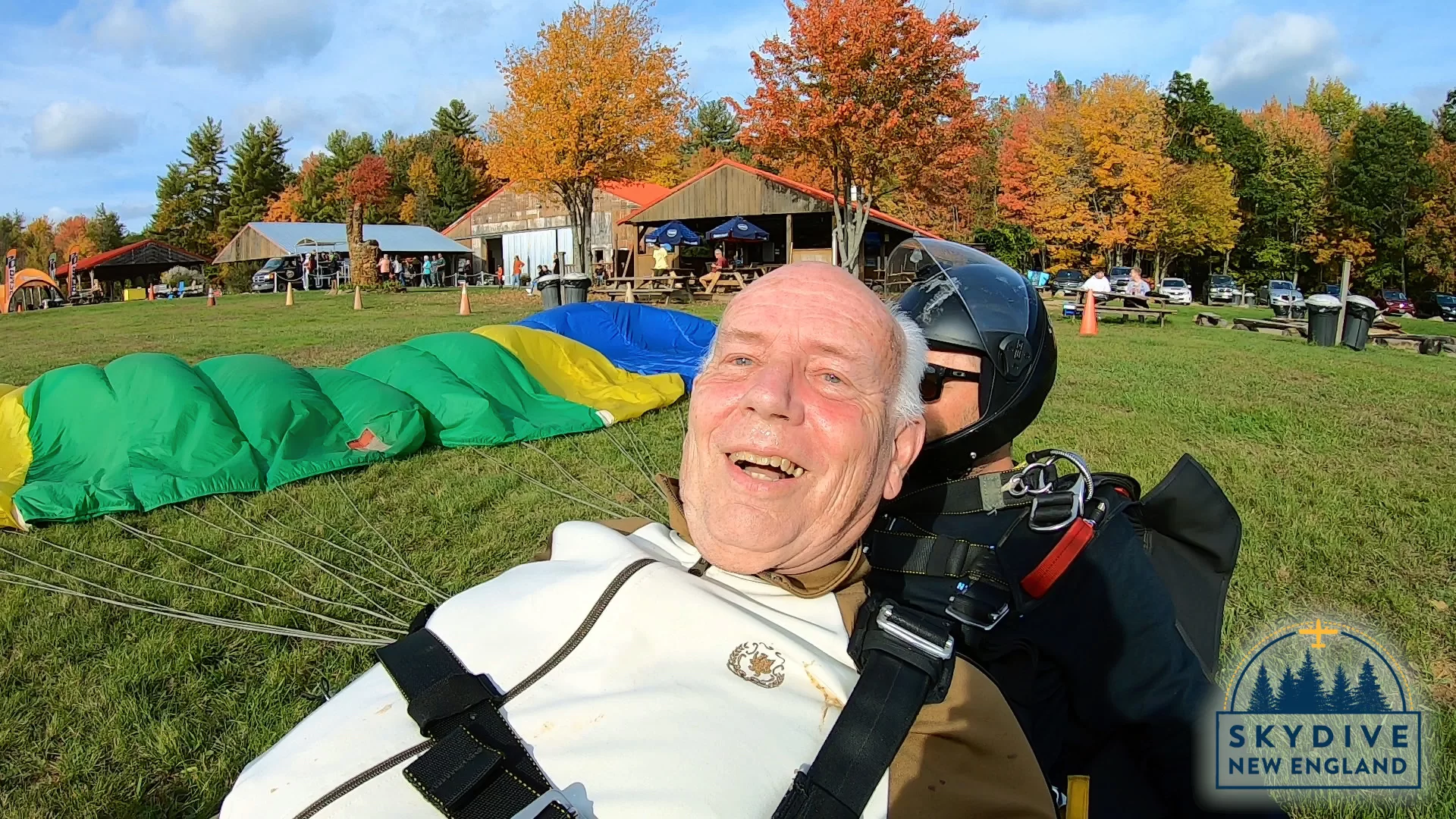 Gene Clough, lecturer emeritus in geology and physics, smiles after completed his tandem skydive at SkyDive New England in Lebanon, Maine, on Oct. 11, 2021 (Photograph courtesy Shred Video)