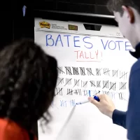 In an effort spearheaded by Bates Democrats, Bates Republicans, and the Harward Center for Community Partnerships, Bates students led a bipartisan effort to get out the vote. Volunteers led walking groups from Commons on the hour and every 15 minutes during peak times to the Lewiston Armory on Central Avenue.In red blazer, Maya Seshan '20 , president of Bates Democrats, of Wilton, Conn.