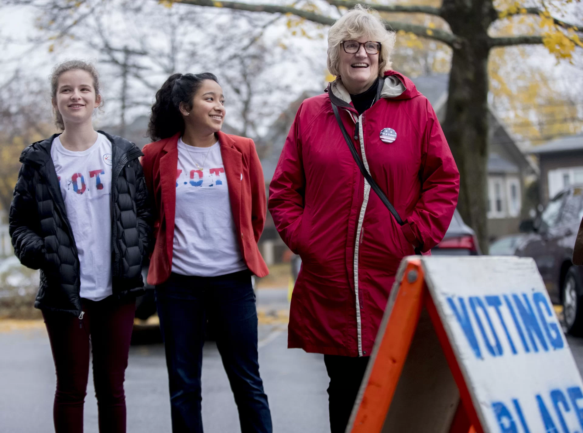 President Clayton Spencer escorts a group of Bates students to the polls on election day, Tuesday, Nov. 6..In an effort spearheaded by Bates Democrats, Bates Republicans, and the Harward Center for Community Partnerships, Bates students led a bipartisan effort to get out the vote. Volunteers led walking groups from Commons on the hour and every 15 minutes during peak times to the Lewiston Armory on Central Avenue.Student IDs:In red jacket, Maya SeshanIn blue jacket with blue jeans, Ella WesterfieldIn maroon pants, Elise GrossfeldIn glasses, long blondish hair, tied VOTE shirt and bean boots, Maya ChessenOn scooter, Michael RatzimbazfyStudent in blue hood, Harkirat Lally Student in aqua blue jacket, Elektra Smicka