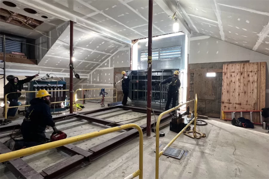 One of the largest components of the Dana Chem HVAC system is winched into the attic around 11:30 on Nov. 29. (Chris Streifel/Bates College)