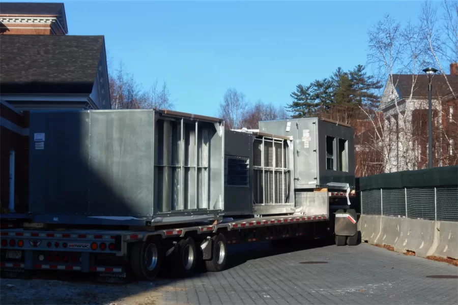 Tight quarters inside the site fence for a tractor-trailer carrying Dana Chem HVAC components. (Doug Hubley/Bates College)