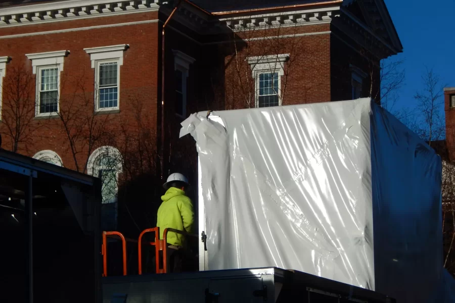 A Cote Corp. employee is shown on a flatbed bearing components of the Dana Chemistry Hall air handler around 8:30 a.m. Nov. 29. (Doug Hubley/Bates College)