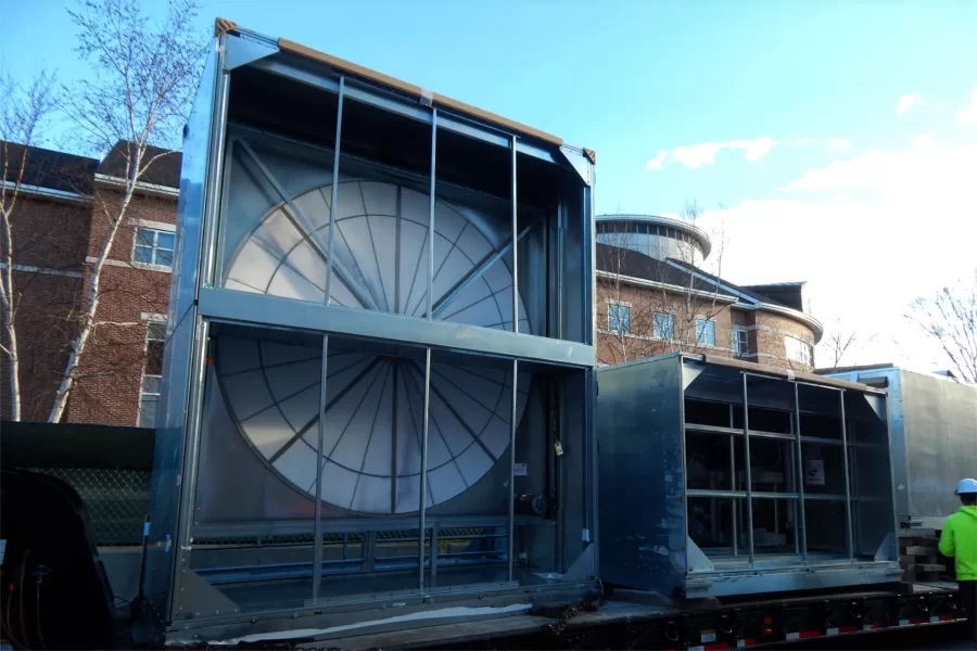 The enthalpy wheel and its housing sit with other HVAC machinery on a flatbed awaiting their loading into Dana Chemistry Hall on Nov. 29. (Doug Hubley/Bates College)