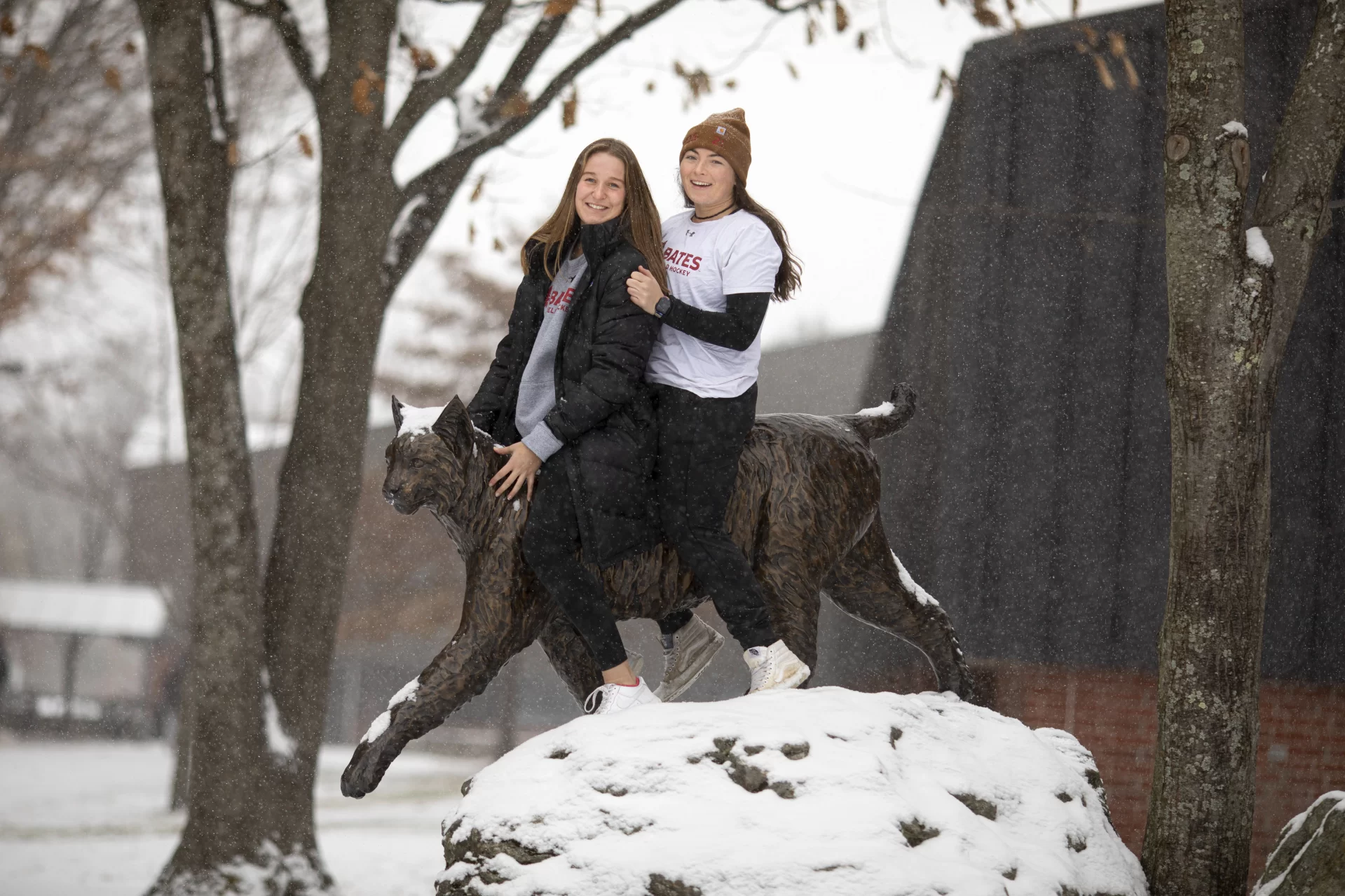 Anna Cote ’25 of Auburn, Maine, and Emily Gianunzio ’22 of Darien, Conn., pose on and by the Bates Bobcat.

They are field hockey teammates this year; last year, Gianunzio, on a one-year leave from Bates because of the pandemic, coached Cote when the latter was a senior at St. Dom’s.