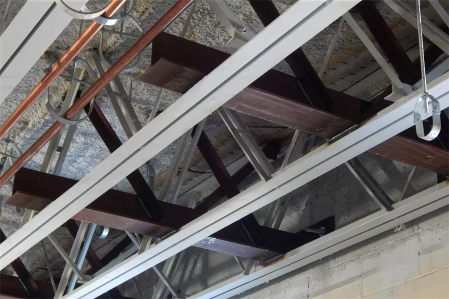 The reddish-brown girders are so-called clips. Recently installed, they tie together Dana Chem’s steel structure and exterior masonry to improve resistance to seismic stresses. (Doug Hubley/Bates College)