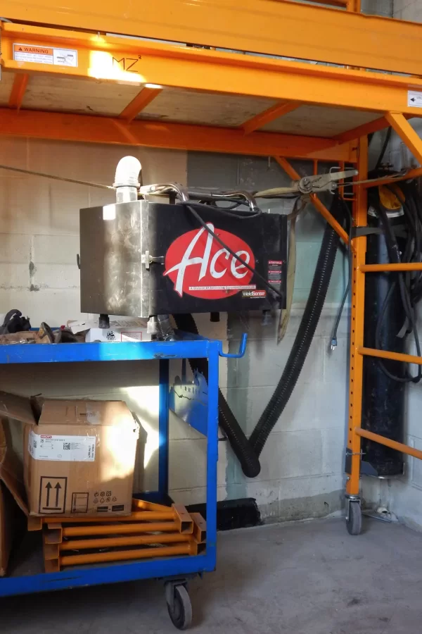 Shown in what will be a third-floor write-up room, "Ace" is a smoke eater — a gizmo that removes smoke created by welding. (Doug Hubley/Bates College)