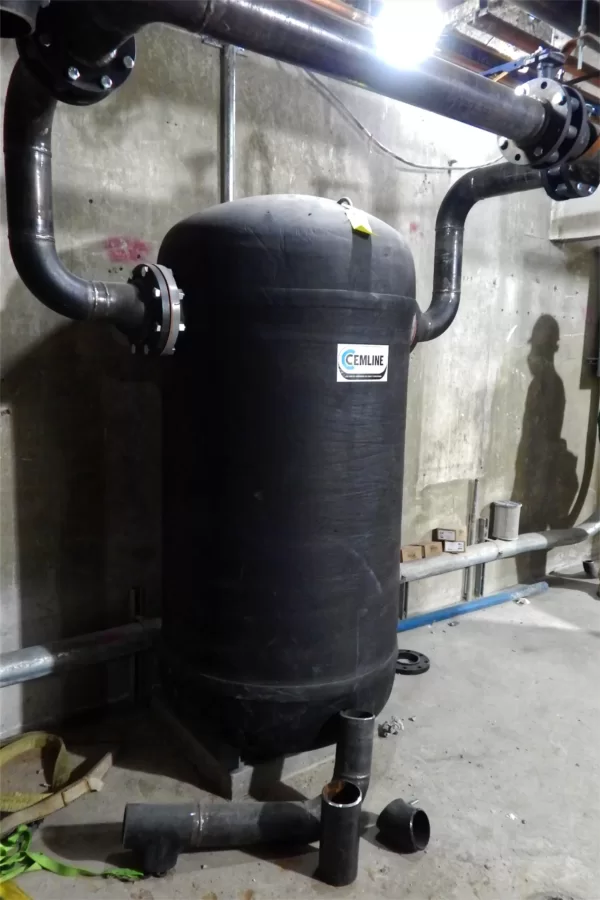New to Dana’s basement, this expansion tank is part of the mechanism that will use steam from the campus heating plant to warm air for the building. (Doug Hubley/Bates College)