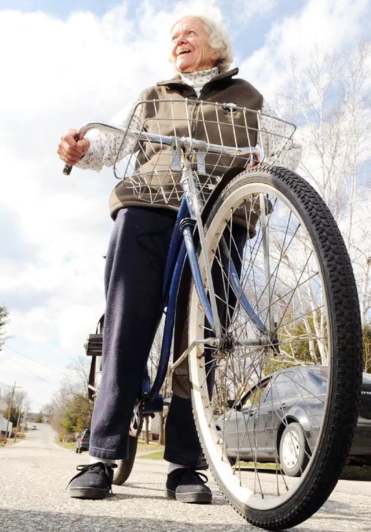 A happy Ruth Slovenski is shown in 2006 after the return — with great fanfare — of her beloved Huffy bicycle. (Photograph courtesy of the Lewiston Sun Journal)


Ruth Slovenski is all smiles after getting her bike back.