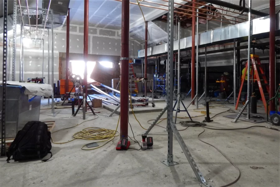 Dana Hall’s attic facing Hathorn Hall. Pipes and machinery have proliferated since Campus Construction Update’s last visit, and there's much more to come. (Doug Hubley/Bates College)