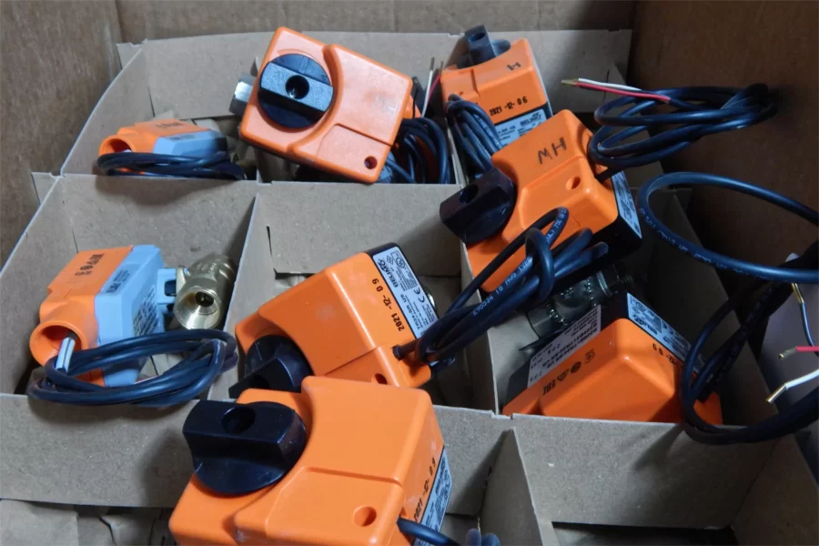 A carton of actuators for HVAC components — or, to use the technical terms, gizmos that hook up to thingamabobs. (Doug Hubley/Bates College)