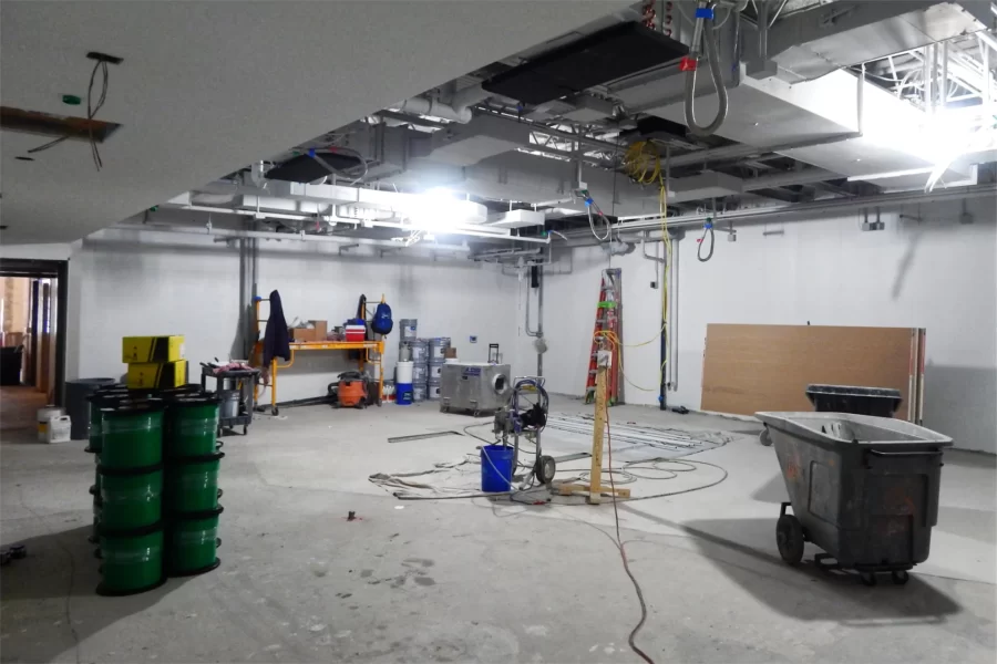New sheetrock and wall paint in Dana 119. The green cable on spools at left will be used for digital network connections. (Doug Hubley/Bates College)