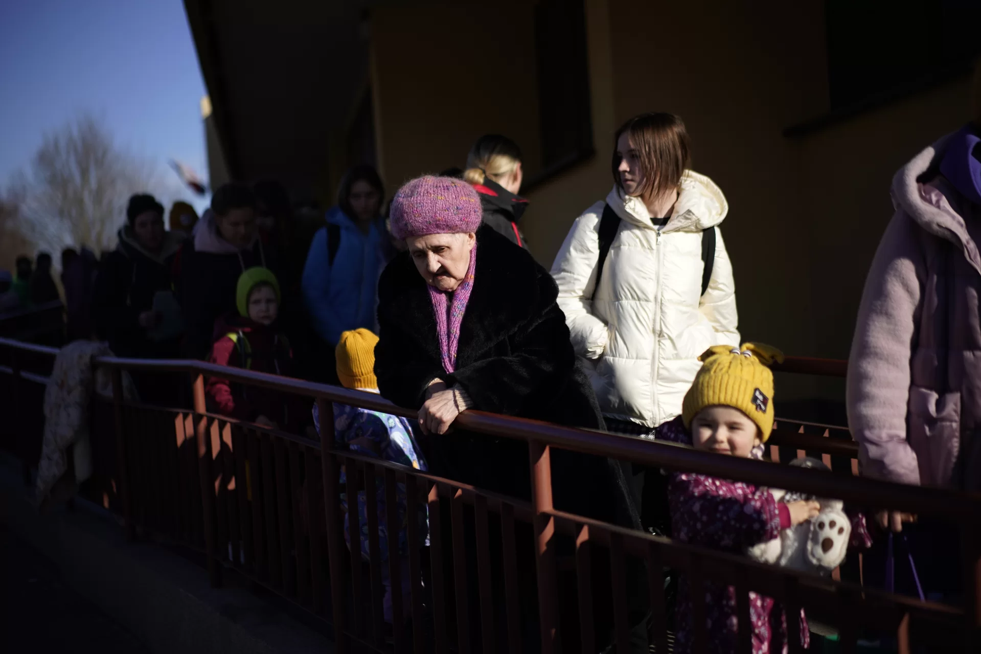 A Ukrainian woman stands as other refugees arrive from Lviv to Przemysl train station, southeastern Poland, on Friday, March 11, 2022. Thousands of people have been killed and more than 2.3 million have fled the country since Russian troops crossed into Ukraine on Feb. 24. (AP Photo/Daniel Cole)