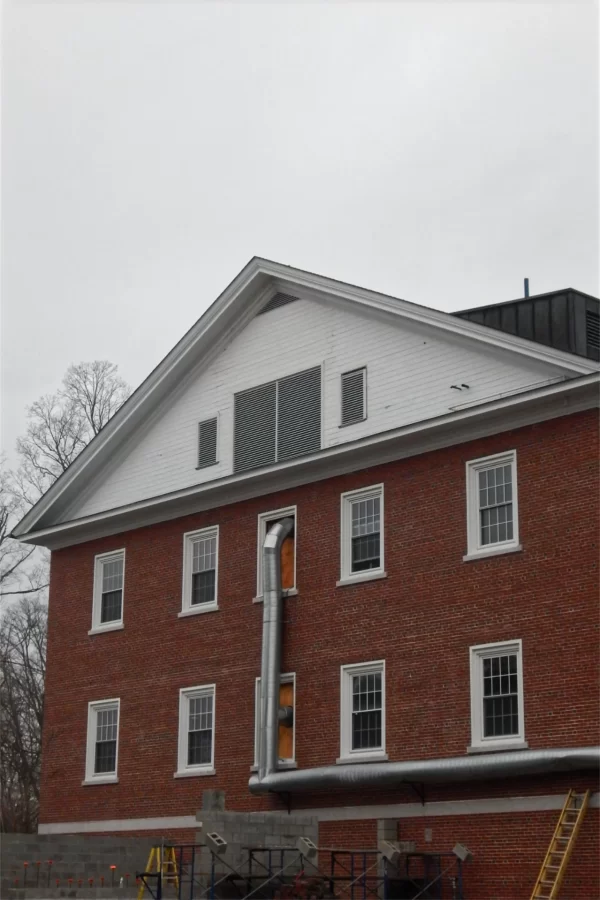 Hello, young louvers: Guarding air intakes for the Dana Hall HVAC system, the louvers at center were installed earlier this month. It was the first time since last summer that those openings had permanent coverings. (Doug Hubley/Bates College)