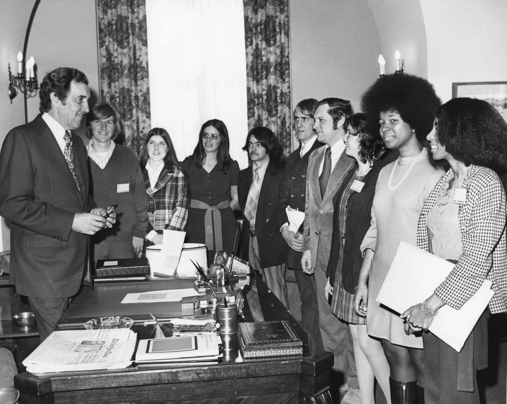 Behind his desk, Sen. Edmund Muskie '36 stands to meet visitors in his Senate office on March 7, 1973. The group may be from the National Student Lobby. (Muskie Archives and Special Collections Library)