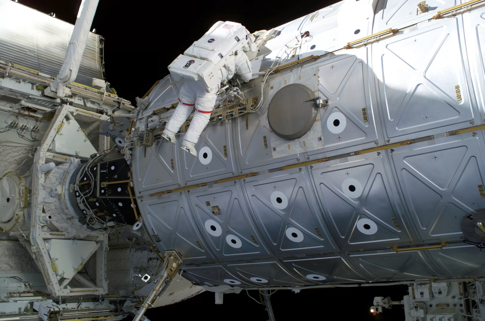 The Cold Atom Lab is within the Destiny laboratory, one of 17 different modules that comprise the International Space Station. Mission Specialist Soichi Noguchi traverses along the Destiny laboratory of the International Space Station in 2017. (NASA)