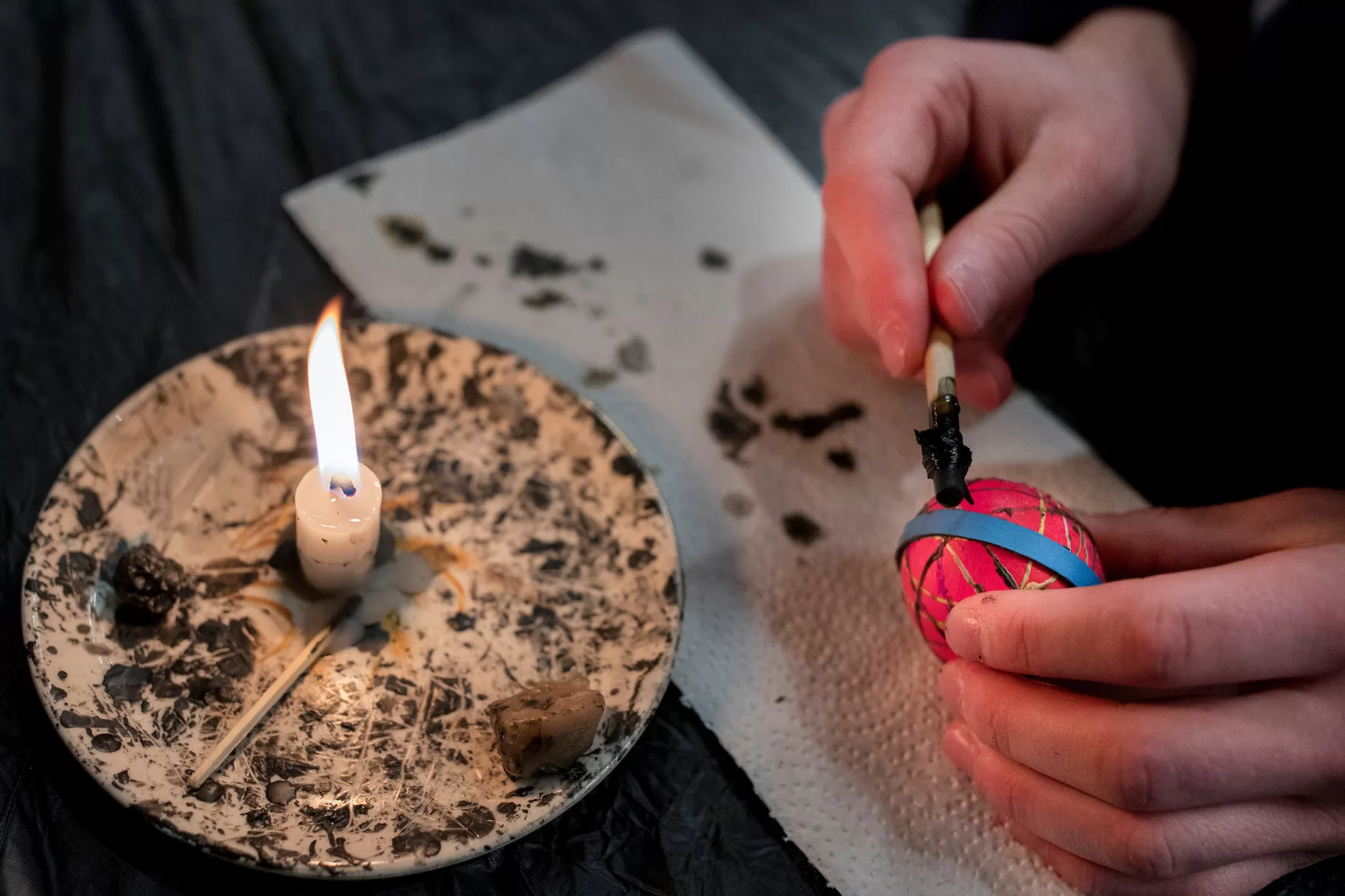 They came for relaxation and a new experience at the end of a busy week. (From top, clockwise) Ian Wax '19, Niamh Micklewhite '19, and Hugh Kenny '19 try their hands at pysanky, Ukranian egg decorating, led by guest artist Lesia Sochor, who demonstrated the art in one of two workshops today in the Edmund S. Muskie Archives.
.
Participants, including area children and their parents and local residents, learned to paint traditional designs onto eggs with beeswax, dye the egg, and then remove the wax to unveil the beautiful designs left behind. The Bates Museum of Art presented the opportunity.