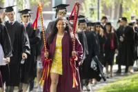 Maya Seshan '19, a junior class marshal for Commencement 2019, leads the senior class as the procession gets underway on May 26, 2019. (Phyllis Graber Jensen/Bates College)
