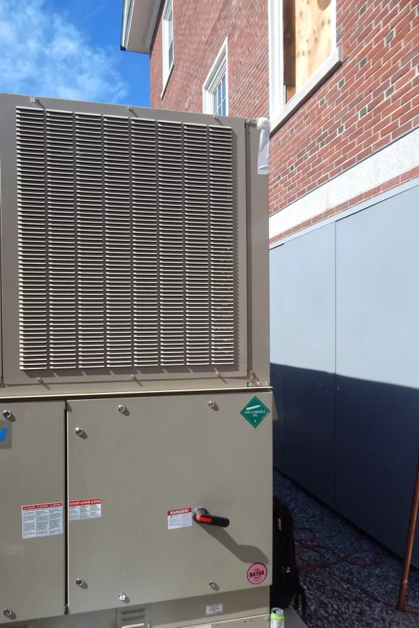 Dana Hall’s new HVAC chiller. The blue panels at right are for soundproofing. (Doug Hubley/Bates College)