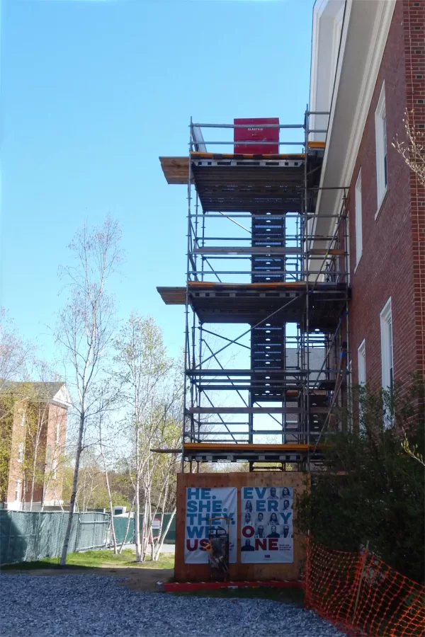 The staging at the Parker Hall end of Dana should go away in a week or so. Most recently, it provided access to the building's upper floors while metalworkers were installing handrails in the interior stairways. (Doug Hubley/Bates College)